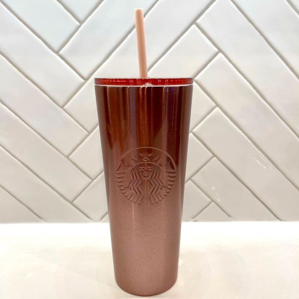 Rose gold Starbucks cold cup with straw